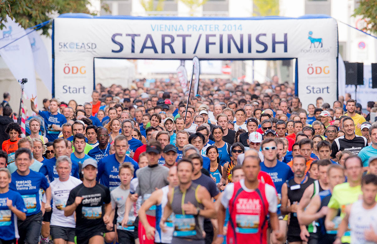 photograph of the starting of the race, just after the runners have left the starting line.